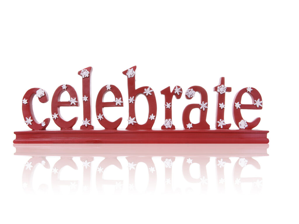 Wooden sign that says Celebrate
