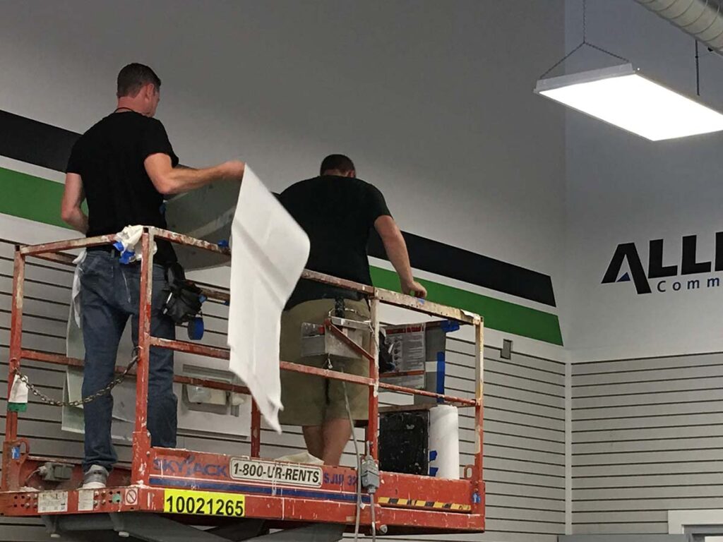 adding vinyl sign to wall