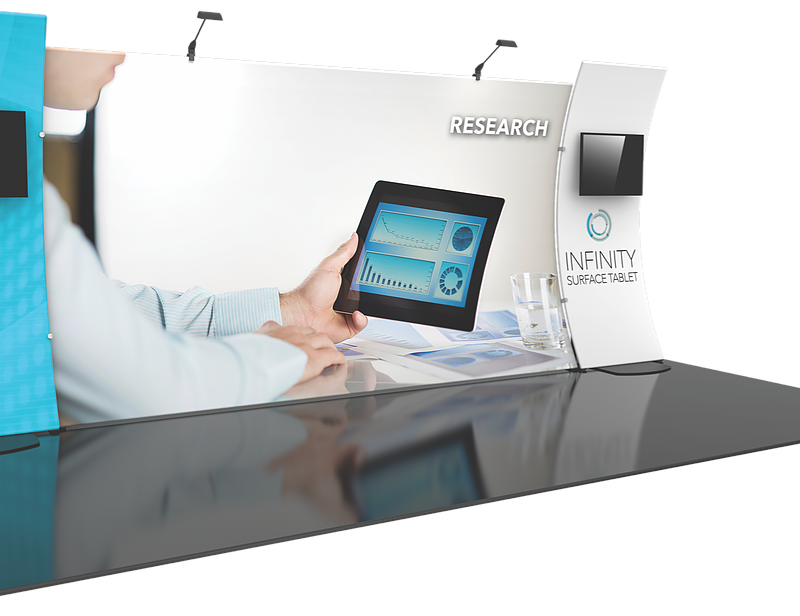 0f7fe7_aa74418c79e54a28bb235a8ecd92efa7mv2 With the backdrop in order, you have plenty of additional choices. For example, there are the customized banners that brand your company, highlight a specific product or display a list of available services. Banners come with banner stands or may be hung from the ceilings. When you visit the exhibition hall, you may be granted the use of several tables. Have customized throws ready to cover up the look of these tables! Since you never know the exact size of the tables, choose runners that are 24 inches and 60 inches wide, which usually cover the customary sizes associated with event venue tables. Table setups are not complete without the use of customized tabletop racks and displays. There is a host of options available for your choice. All feature an option for branding your company and enhancing name awareness. Above and beyond this requirement, there are taller or shorter, spinning or stationary, flat or angled displays. To add a bit of pizzazz to the booth, consider utilizing iPad stands as well as brochure racks for a more interactive experience.